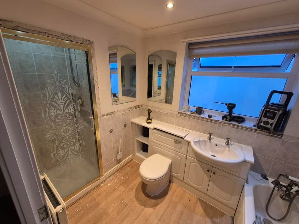 Fitted bathroom vanity unit with herringbone floor and shutters by PJB