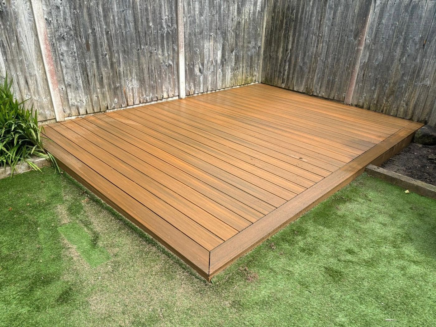 Finished composite garden decking installed by PJB