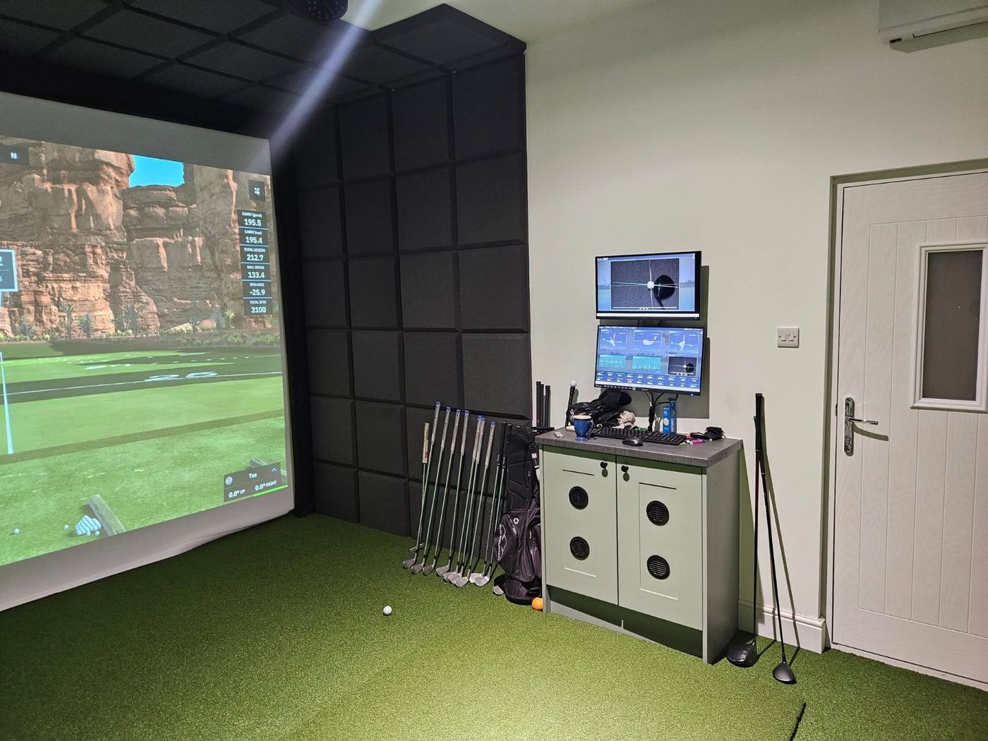 Garden room golf simulator build with screen and turf by PJB
