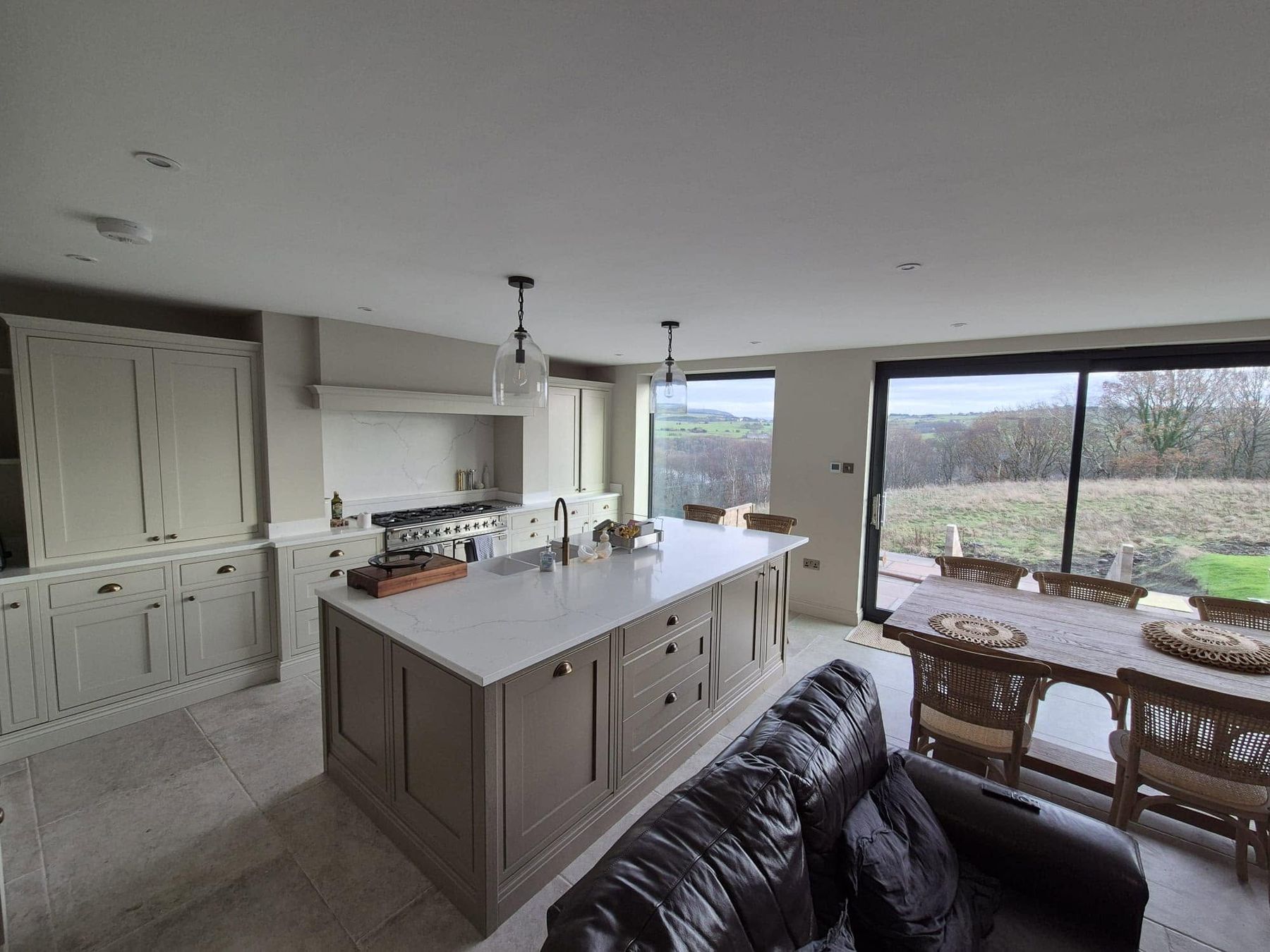 Bespoke shaker kitchen with large island and quartz worktops fitted by PJB