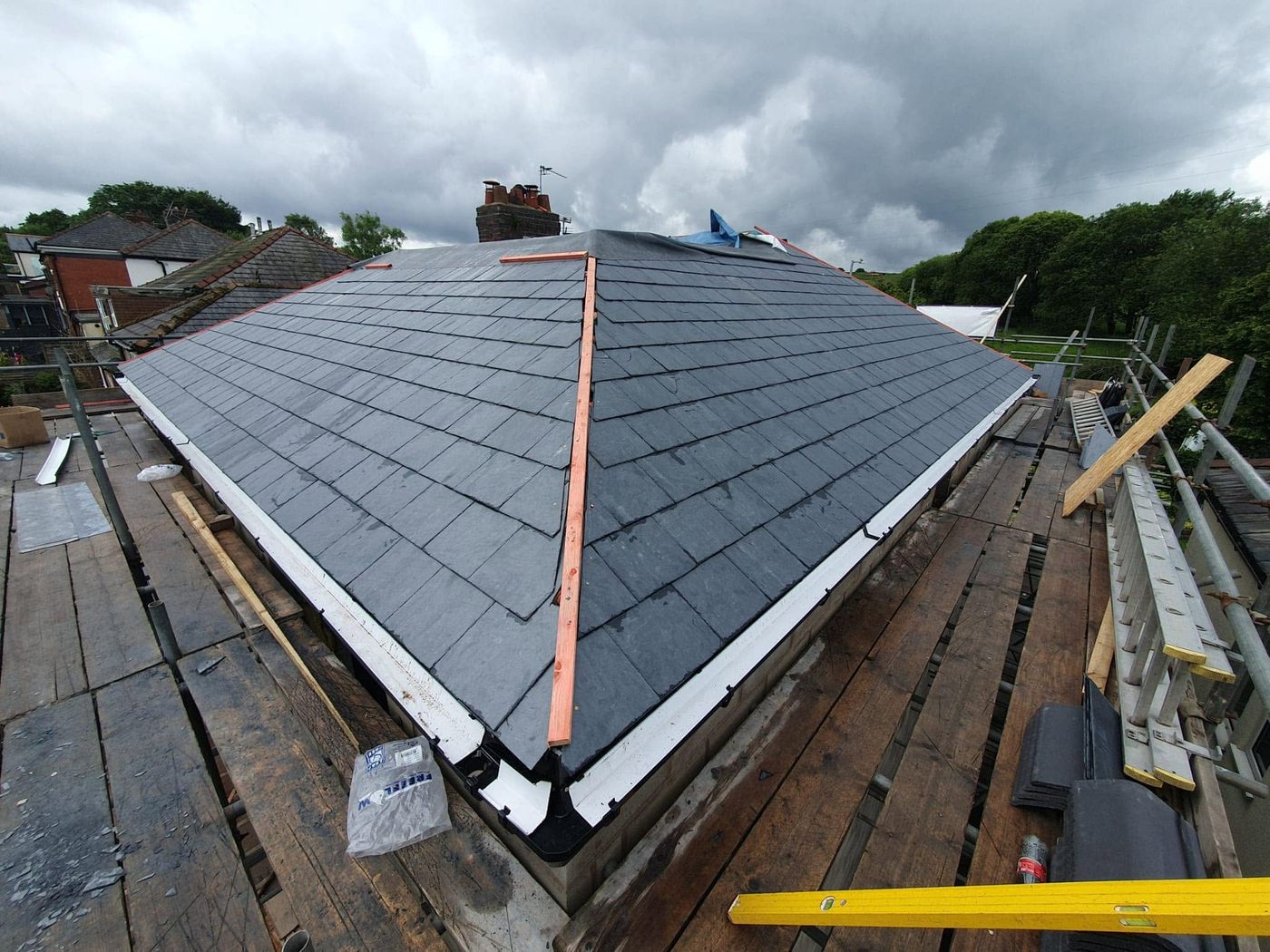 Newly completed slate roof with lead detailing by PJB